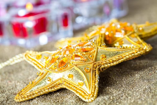 Close-up of star shape Christmas decorations with candles