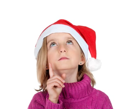Little girl with santa hat pointing up