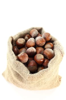 a jute sack filled with hazelnuts