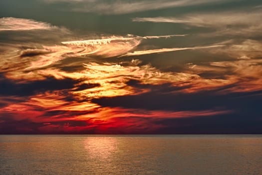 A dramatic evening sunset over water