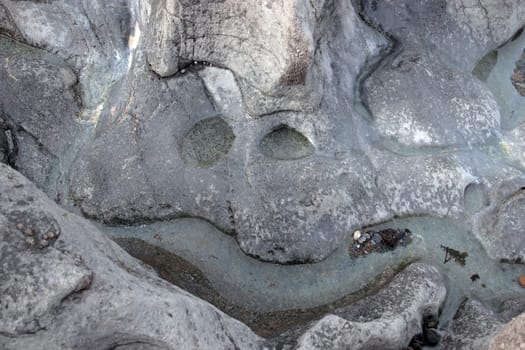 a smiley face shape on a rock pool surface