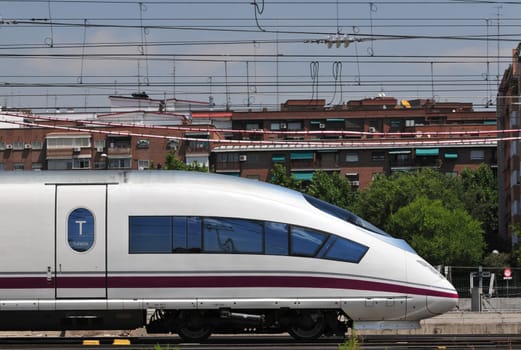 High speed passenger train leaving Atocha railway station in Madrid (Spain).