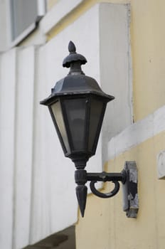Street lighter on a building wall