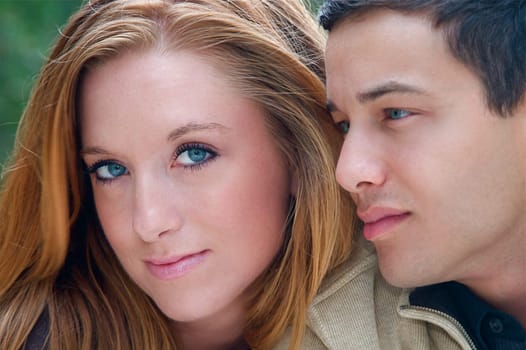 Young couple in an autumn forest picnic area