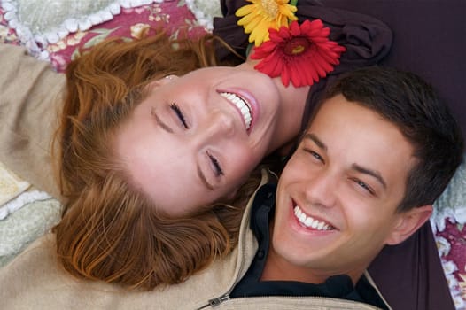Young couple in an autumn forest picnic area