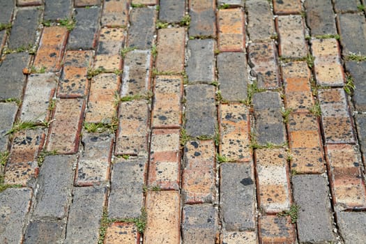 The close up texture of a patterned brick background