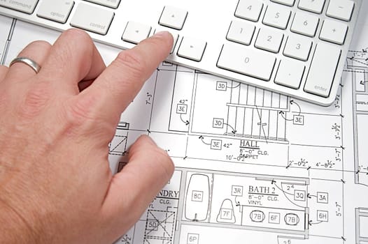 Modern architect&#039 s office with blueprint and computer keyboard