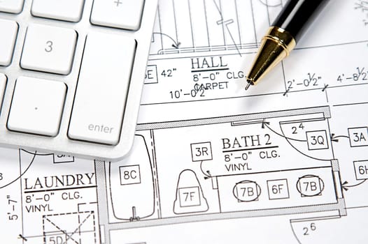 Modern architect&#039 s office with blueprint and computer keyboard