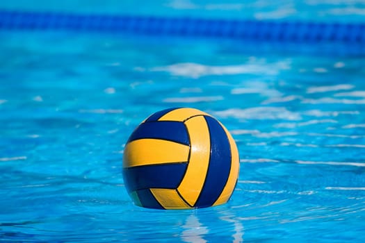 Water polo action and equipment in a swimming pool