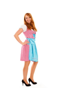 Standing young redhead woman in dirndl on white background