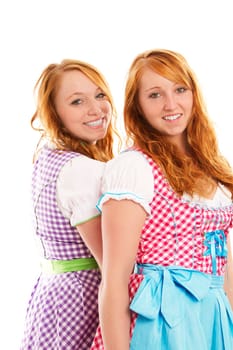 Two women in dirndl on white background