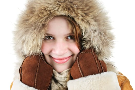 Beautiful young woman in fur hood of winter coat