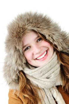 Beautiful young woman in fur hood of winter coat on white background