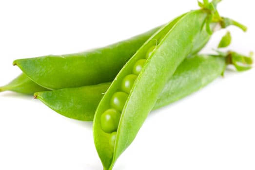 Ripe pea vegetable with green leaf isolated on white background