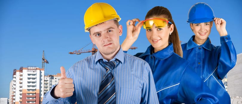 Portrait of architects at in front of construction site, building and crane.