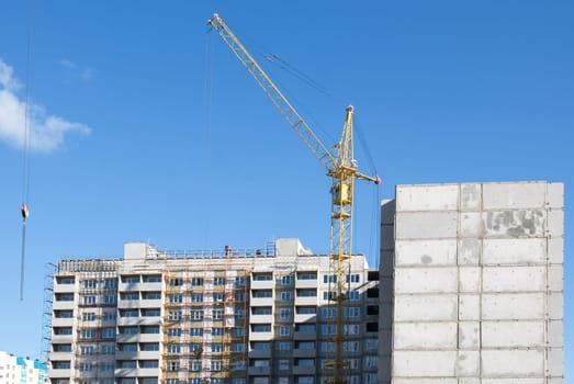 crane and building under construction on the skyline