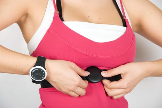 Girl with checking pulse watch closeup