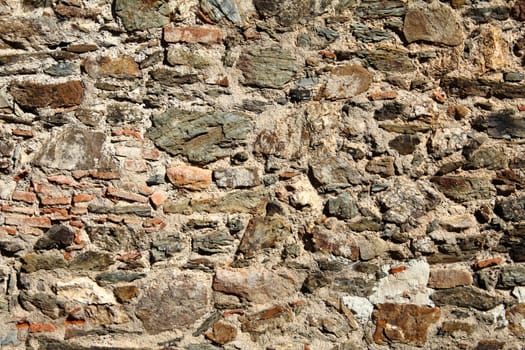 Background - Old wall made of different stones