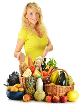 Young woman with groceries isolated on white