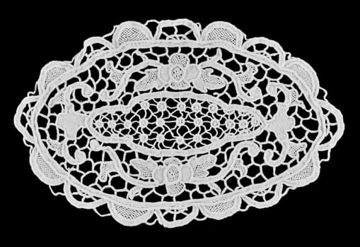 White handmade lace (oval form), isolated on black.