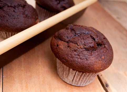Baking of Muffins - Chocolate Muffin and Cake Tin on Wooden Table
