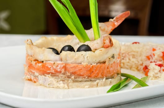 tasty prepared fish with rice and vegetables