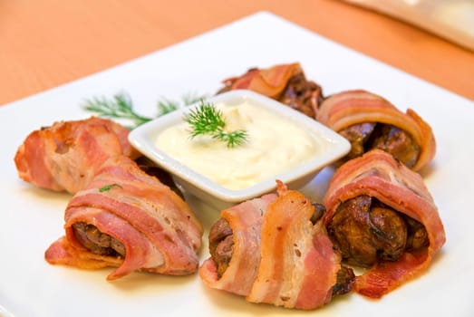 tasty rolls of bacon and chicken liver