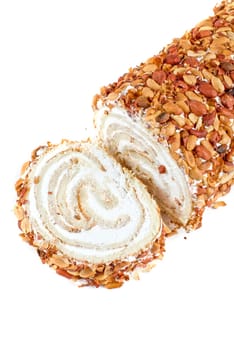 Nuts Swiss roll closeup isolated on a white background
