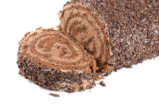 Chocolate Swiss roll closeup isolated on a white background