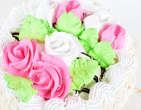 cream cake closeup with cherry on a grey