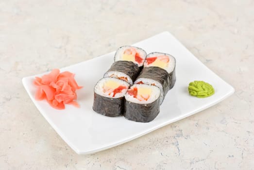 Sushi rolls made of crab meat, cheese, and tomato
