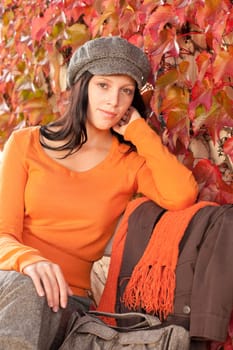 Autumn leaves fashion portrait scenery young woman relax sitting on bench