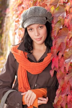 Autumn leaves portrait of beautiful female model posing fashion outfit