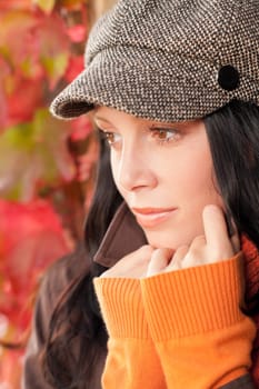 Autumn portrait of beautiful female model posing face close-up