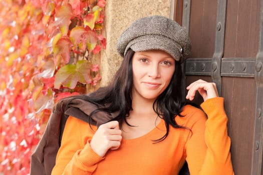 Autumn leaves portrait of beautiful female model posing fashion outfit