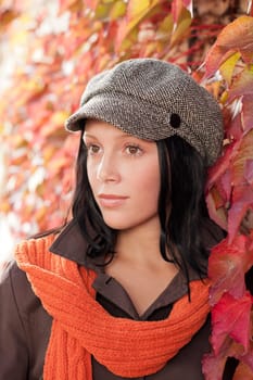Autumn leaves portrait of beautiful female model posing fashion outfit