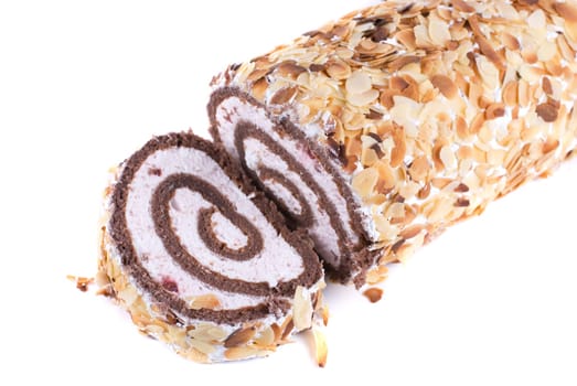 Nuts Swiss roll closeup isolated on a white background