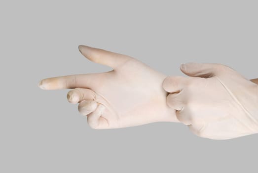 gloves on a hand on a grey background