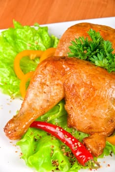 roasted chicken ham garnished with fresh green salad, pepper and greens