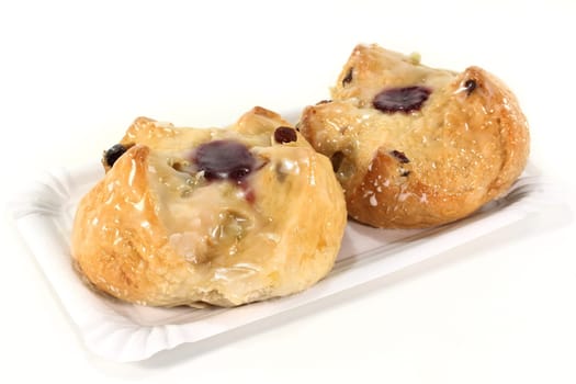 Two Reformation buns against white background