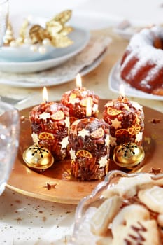 Christmas decoration with candles and jingle bells