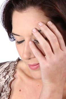Lovely woman with eyes closed and hand on face