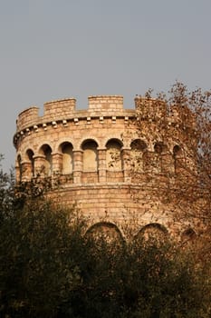 Replica of a castle tower built in stone with arches