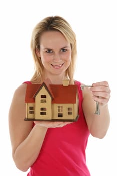 Lovely estate agent woman with keys and conceptual house for sale
