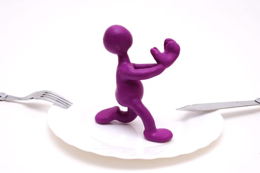 Purple man puppet of plasticine begging for life