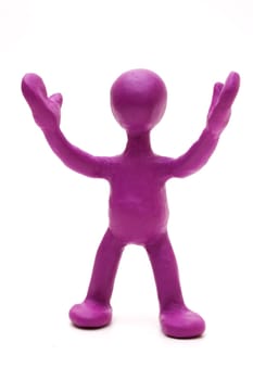Purple man puppet of plasticine signing by hands