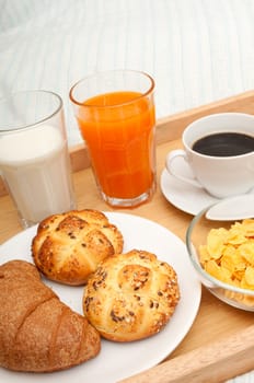 Breakfast in Bed - Corn Flakes, Coffee, Croissant, Orange Juice, Coffee, Milk and Rolls