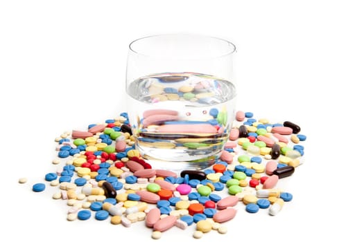 Medical concept created by pills . Isolated on white