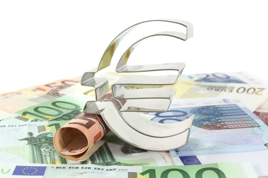 Euro bills and euro signs against white background