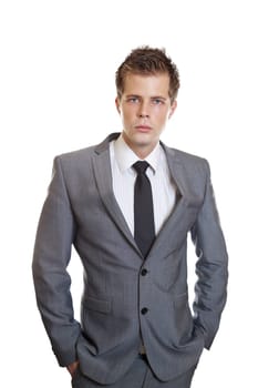 Young successful businessman with hands in pockets